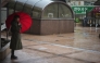 (FILE PHOTO) A woman holding an umbrella stands on a street in rain brought by Typhoon Jangmi in Tokyo, Japan, June 3, 2026. (Xinhua/Jia Haocheng)

