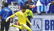 Qatar goalkeeper Mahmoud Abunada in action during the match against El Salvador on Saturday.  