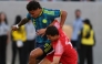 Richard Rios of Colombia fights for the ball with Mohammad Abualnadi of Jordan.