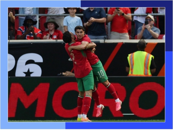 Morocco's Brahim Diaz celebrates with teammate Achraf Hakimi after scoring a goal against Norway during a friendly match on Sunday. (AFP)