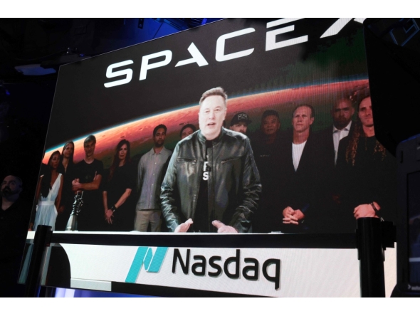 SpaceX founder and CEO Elon Musk speaks via video at the Nasdaq Marketsite in Times Square during the launch of the SpaceX initial public offering (IPO) on the Nasdaq on June 12, 2026, in New York City. Photo by SPENCER PLATT / GETTY IMAGES NORTH AMERICA / Getty Images via AFP
