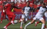Canada's forward #09 Cyle Larin (L) scores the equalizer during the 2026 World Cup Group B football match between Canada and Bosnia and Herzegovina at the Toronto Stadium in Toronto on June 12, 2026. (Photo by Cole Burston / AFP)