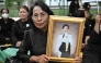A mourner holds a portrait of late Thai Princess Bajrakitiyabha Mahidol outside the Grand Palace in Bangkok on June 13, 2026. (Photo by Lillian Suwanrumpha / AFP)