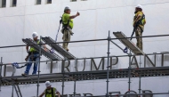 Construction crews build scaffolding outside The Kennedy Center on June 13, 2026 in Washington, DC. Friday marks the court-ordered deadline to remove President Donald trump's name from the Kennedy Center. (Photo by TASOS KATOPODIS / GETTY IMAGES NORTH AMERICA / Getty Images via AFP)