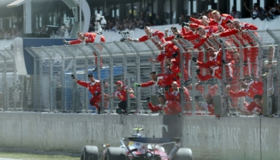 Ferrari team members celebrate Ferrari's British driver Lewis Hamilton's victory in the Catalonia Formula One Grand Prix at the Circuit de Catalunya in Montmelo, on the outskirts of Barcelona, on June 14, 2026. (Photo by Lluis GENE / AFP)
