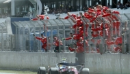 Ferrari team members celebrate Ferrari's British driver Lewis Hamilton's victory in the Catalonia Formula One Grand Prix at the Circuit de Catalunya in Montmelo, on the outskirts of Barcelona, on June 14, 2026. (Photo by Lluis GENE / AFP)