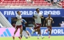 Qatar's Edmilson Junior (left), Homam Al Amin (centre) and Jassim Jaber warm up ahead of match against Switzerland.