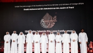 Minister of Endowments (Awqaf) and Islamic Affairs H E Ghanem bin Shaheen bin Ghanem Al Ghanim, Minister of Commerce and Industry H E Sheikh Faisal bin Thani bin Faisal Al Thani, Chairman of the Organizing Committee and Vice Chairman of Bait Al-Mashura Finance Consultations Prof. Dr. Khalid bin  Ibrahim Al-Sulaiti with other dignitaries during the conference yesterday. Pic: Salim Matramkot