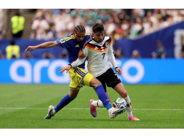 Armando Obispo #18 of Curacao challenges Kai Havertz #7 of Germany during the FIFA World Cup 2026 Group E match between Germany and Curacao at Houston Stadium on June 14, 2026 in Houston, Texas. Lars Baron/Getty Images/AFP 