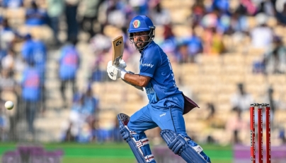 Afghanistan's captain Hashmatullah Shahidi plays a shot during the third one-day international (ODI) cricket match between India and Afghanistan on June 20, 2026. (Photo by R.Satish Babu / AFP)