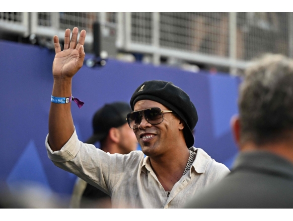 Brazilian former football star Ronaldinho waves ahead of the 2026 World Cup Group C football match between Brazil and Haiti at the Philadelphia Stadium in Philadelphia on June 19, 2026. (Photo by Jewel SAMAD / AFP)