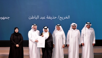 Undersecretary of the Ministry of Awqaf and Islamic Affairs Sheikh Khalid bin Mohammed bin Ghanem Al Thani honours a graduate during the ceremony, while Undersecretary of the Ministry of Education and Higher Education Dr. Ibrahim bin Saleh Al Nuaimi, looks on. Pic: Salim Matramkot/The Peninsula