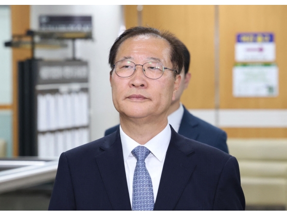 Former South Korean Justice Minister Park Sung-jae arrives for his trial at the Seoul Central District Court in Seoul on June 22, 2026. (Photo by YONHAP / AFP)