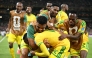 South Africa's forward #12 Thapelo Maseko is hugged by teammates while celebrating scoring his team's first goal. (Photo by Yuri Cortez / AFP)