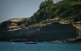 Firefighters search by boat at the base of the cliff from which a section collapsed near Miramar beach, killing one woman and leaving a diver missing, in Biarritz, south-western France, on June 25, 2026. Photo by PHILIPPE LOPEZ / AFP