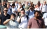 Commuters walk in the sun as they cross London Bridge, during a heatwave, in central London on June 24, 2026. (Photo by Toby Shepheard / AFP)