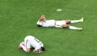 Saudi Arabia's Abdulelah Al-Amri and Ali Lajami react after being eliminated following the 0-0 draw with Cape Verde.