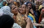 Relatives mourn the deceased children before their burial in Lahore on July 1, 2026, after the roof of a tutoring centre collapsed the previous day. Photo by Arif Ali / AFP