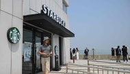 A visitor walks past a Starbucks store offering a view of North Korea at a South Korean observation deck at Aegibong Peace Ecopark in Gimpo on July 1, 2026. Photo by Jung Yeon-je / AFP
