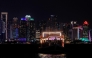 Illuminated skyscrapers are pictured along the corniche promenade in Doha on June 29, 2026. (Photo by Karim Jaafar / AFP)
