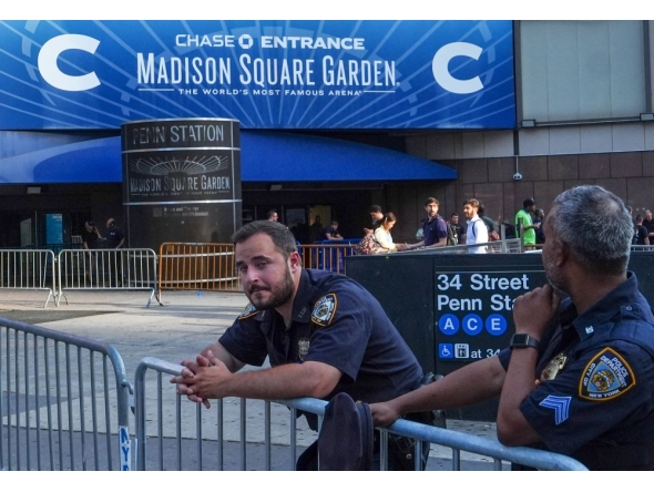 New York City police officers stand guard outside Madison Square Garden in Manhattan, New York on July 2, 2026. Photo by Ryan Murphy / AFP