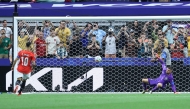 Egypt's forward #10 Mohamed Salah (L) shoots and scores past Australia's goalkeeper #01 Mathew Ryan in a penalty shoot-out during the 2026 World Cup round of 32 football match between Australia and Egypt at the Dallas Stadium in Arlington on July 3, 2026. (Photo by Thomas COEX / AFP)