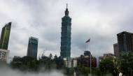 A mist installation is seen at Sun Yat-sen Memorial Hall with Taipei 101 in the background, in Taipei (Photo by I-Hwa Cheng / AFP)