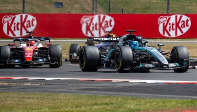 Mercedes' British driver George Russell (R) leads Ferrari's Monegasque driver Charles Leclerc (L) during the sprint race ahead of the Formula One British Grand Prix at the Silverstone motor racing circuit in Silverstone, central England, on July 4, 2026. (Photo by Andrej ISAKOVIC / AFP)
