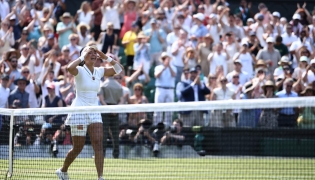 Philippines' Alexandra Eala celebrates beating Poland's Iga Swiatek during their women's singles third round tennis match on the sixth day of the 2026 Wimbledon Championships at The All England Lawn Tennis and Croquet Club in Wimbledon, southwest London, on July 4, 2026. (Photo by Henry NICHOLLS / AFP) / RESTRICTED TO EDITORIAL USE