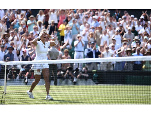 Philippines' Alexandra Eala celebrates beating Poland's Iga Swiatek during their women's singles third round tennis match on the sixth day of the 2026 Wimbledon Championships at The All England Lawn Tennis and Croquet Club in Wimbledon, southwest London, on July 4, 2026. (Photo by Henry NICHOLLS / AFP) / RESTRICTED TO EDITORIAL USE