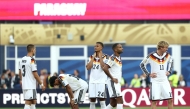 Germany’s players react after losing the penalty shootout against Paraguay.