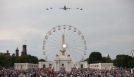 The new Air Force One escorted by US Air Force F-22 Raptors flies over the National Mall during the 