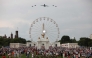 The new Air Force One escorted by US Air Force F-22 Raptors flies over the National Mall during the 