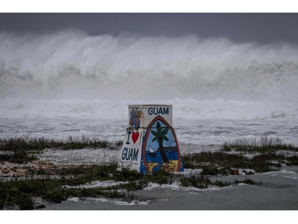 High waves crash against the coastline at a beach as the forecasted Super Typhoon Bavi approaches in Guam on July 5, 2026.(Photo by Yuichi YAMAZAKI / AFP)