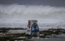 High waves crash against the coastline at a beach as the forecasted Super Typhoon Bavi approaches in Guam on July 5, 2026.(Photo by Yuichi YAMAZAKI / AFP)