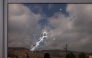 This picture shows a bullet hole on the window of a restaurant after it was burned down by settlers during an attack in the western area of the Al-Lubban ash-Sharqiya village, south of Nablus, in the occupied West Bank on on July 5, 2026. (Photo by JAAFAR ASHTIYEH / AFP)