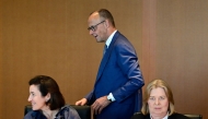 German Chancellor Friedrich Merz walks past German Minister for Research, Technology and Aerospace Dorothee Baer (front L) and German Minister for Labour and Social Affairs Baerbel Bas prior to the weekly cabinet meeting at the Chancellery in Berlin, Germany, on July 6, 2026. (Photo by John MACDOUGALL / AFP)