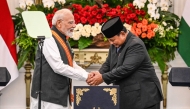 India's Prime Minister Narendra Modi (L) and Indonesia's President Prabowo Subianto shake hands after attending a joint press conference at the Merdeka Palace in Jakarta on July 7, 2026. (Photo by AFP)