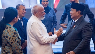 India's Prime Minister Narendra Modi (centre L) shakes hands with Indonesia's President Prabowo Subianto (R) during his visit at the parliament building in Jakarta on July 7, 2026. (Photo by KRISTIANTO PURNOMO / AFP)