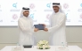 Executive Director of QCDC Saad Abdulla Al-Kharji and Deputy Chief Executive Officer of QFSW Khalid bin Mohammed Al-Kuwari exchange documents after signing of the MoU.