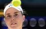 Czech Republic's Linda Noskova stares at the ball before returning to Belgium's Elise Mertens during their women's singles quarter-final tennis match on the tenth day of the 2026 Wimbledon Championships at The All England Lawn Tennis and Croquet Club in Wimbledon, southwest London, on July 8, 2026. (Photo by Kirill KUDRYAVTSEV / AFP)