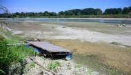 A floating dock for boats is seen lying on the riverbed along the river Po in Castelvetro Piacentino, near Cremona, Northern Italy on July 3, 2026. Photo by PIERO CRUCIATTI / AFP