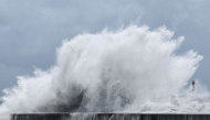 Strong waves break along the coast in Yilan on July 10, 2026, as Typhoon Bavi moves toward Northeastern Taiwan. (Photo by I-Hwa Cheng / AFP)