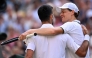 Italy's Jannik Sinner winks at Serbia's Novak Djokovic after beating him during their men's singles semi-final tennis match on the twelfth day of the 2026 Wimbledon Championships at The All England Lawn Tennis and Croquet Club in Wimbledon, southwest London, on July 10, 2026. (Photo by Kirill KUDRYAVTSEV / AFP) 