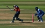 England's Jos Buttler hits a boundary as India's Sanju Samson keeps wicket during the fifth Twenty20 (T20) International cricket match between England and India at Utilita Bowl in Southampton on July 11, 2026. (Photo by JUSTIN TALLIS / AFP)