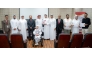 Director of Human Resources at QIIB Sheikh Ali bin Abdullah al-Thani and Executive Director of the Qatar Society for Rehabilitation of Special Needs Amir al-Mulla alongside senior representatives from both organisations pose for a group photo.