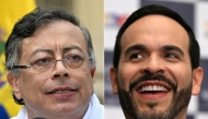 (FILES) (COMBO) This combination of file pictures created on July 07, 2026 shows Colombia's President Gustavo Petr (L) speaking after casting his vote during the presidential election in Bogota on May 31, 2026, and Colombia's presidential candidate Abelardo de la Espriella smiling during the presentation of his running mate Jose Manuel Restrepo at the Cali registration office in Cali, Colombia, on March 12, 2026.  (Photo by Luis Acosta and Joaquin Sarmiento/ AFP)