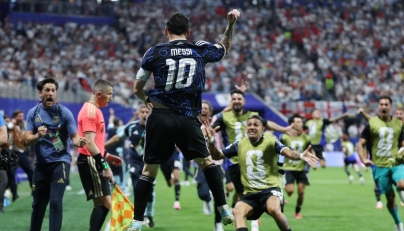 Argentina's forward #10 Lionel Messi celebrates his team's second goal scored by Argentina's forward #22 Lautaro Martinez (out of frame) during the 2026 World Cup football tournament semi-final match between England and Argentina at the Atlanta Stadium in Atlanta on July 15, 2026. (Photo by Thomas COEX / AFP)