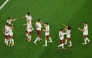 Spain’s players celebrate after Mikel Oyarzabal scored his team’s first goal during the semi-final against France on Tuesday. (AFP)