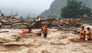 This photo taken and released by Vietnam News Agency (VNA) on July 17, 2026, shows rescue workers addressing the aftermath of flash floods in Muong Than Commune, Lai Chau Province, northern Vietnam. (Photo by Vietnam News Agency (VNA) / AFP)